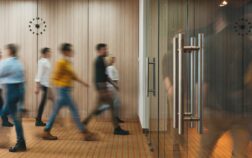 Group of office people walking at office open space. Team of business employees at coworking center. People at motion blur. Concept working at action Group of office people walking at office open space. Team of business employees at coworking center. People at motion blur. Concept working at action