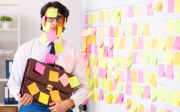 Young employee in conflicting priorities concept Young employee in conflicting priorities concept