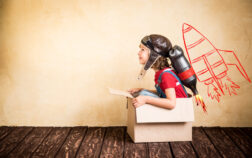 Kid playing with jet pack at home Kid with jet pack. Child playing at home. Success, leader and winner concept