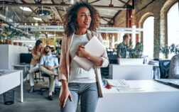 Young business people in office Group of young multiracial business people are working in modern office. Freelancers in coworking place. Creative and stylish youth.